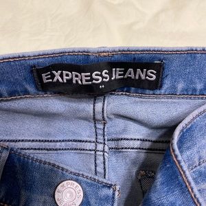 Like new. Ripped Express jeans. Washed blue.